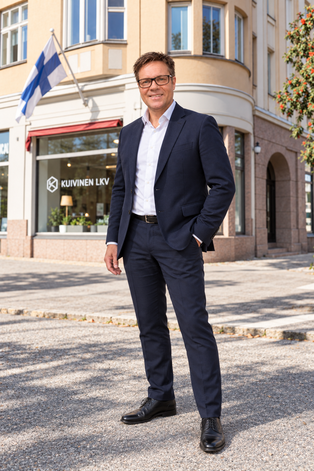 Full-length portrait of Esko Savioja outside the Kuivinen LKV office